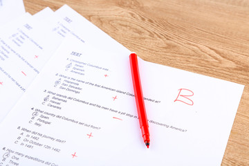 Grade written on an exam paper, close-up