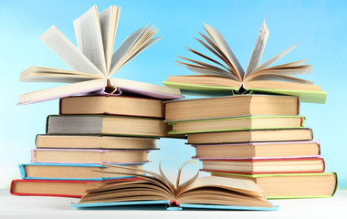 Stacks of books on table on natural background