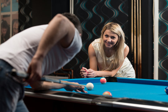 Beautiful Couple Playing Pool