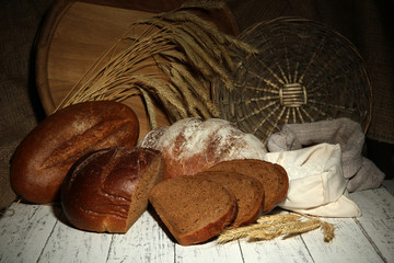 Composition with rye bread on table on wicker background