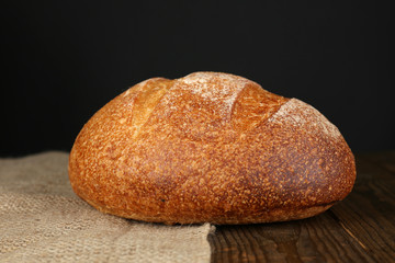 Loaf of bread on dark background
