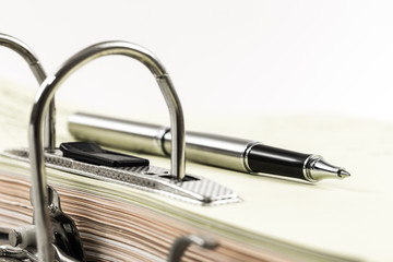 metall office binder close up with documents stacked