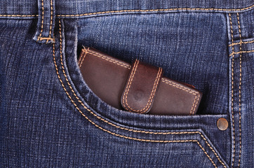 Brown wallet in the jeans front pocket