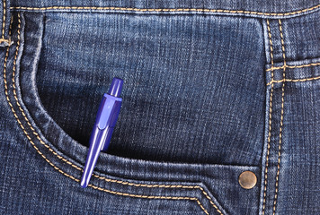 Pen in the front pocket of blue jeans