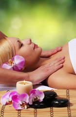 Fototapeta na wymiar Spa Massage. Beautiful Blonde Woman Getting Body Massage