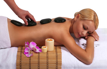 Obraz na płótnie Canvas Spa Stone Massage. Blonde Woman Getting Hot Stones Massage