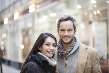 portrait of handsome couple city lights in the background