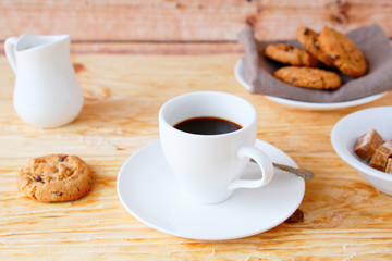 coffee with cookies on the wooden background