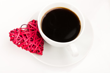 Red straw heart and cup of coffee