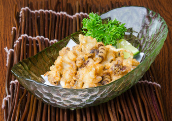 japanese cuisine. fried squid on the background