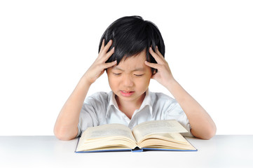 Asian boy getting headache from doing homework