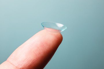 Contact lens on finger - 61393983