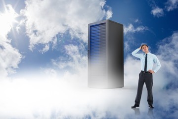 Composite image of thoughtful businessman with hand on head