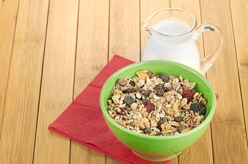 Delicious and healthy cereal in bowl with milk