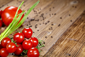 Tomatoes, onions, pepper and garlic isolated on the old wood tab
