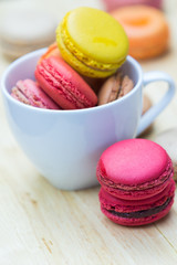 Macaron in coffee cup