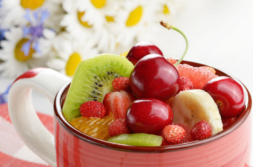 Red cup with fruits
