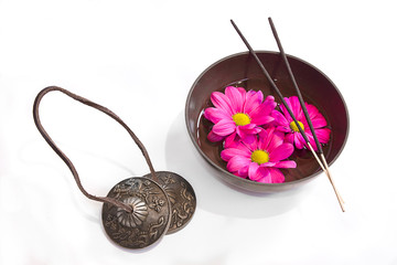 Oriental health treatment: tingsha, tibetan bowl and incense.