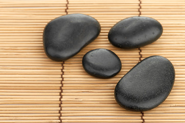 The spa a stone on bamboo background