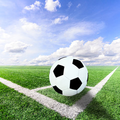 Fototapeta premium Ball on Corner of a soccer field and blue sky