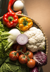 still life with vegetables isolated on brown background