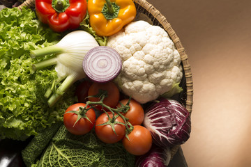 still life with vegetables isolated on brown background