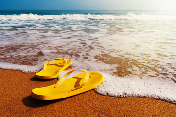 slippers on a sandy beach