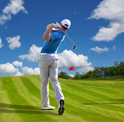 Gordijnen Man playing golf against blue sky © Tomas Marek