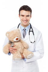 Doctor holding teddy bear