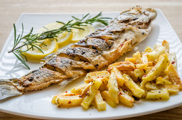 Baked seabass with fried potatoes