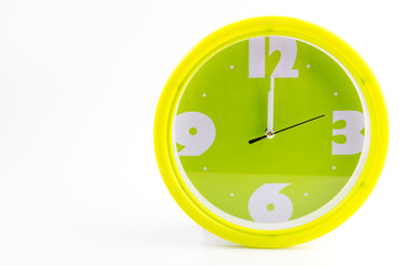 Green clock alarm isolated on white background