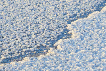Obraz premium Crack on ice. Background and texture of snow and ice.