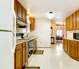 White kitchen with wooden storage combination