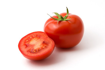 Tomato and half a tomato on a white background