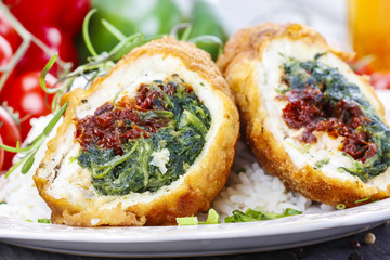 Chicken roll stuffed with spinach and dried tomatoes