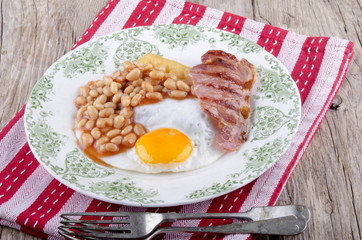 grilled bacon, beans and fried egg