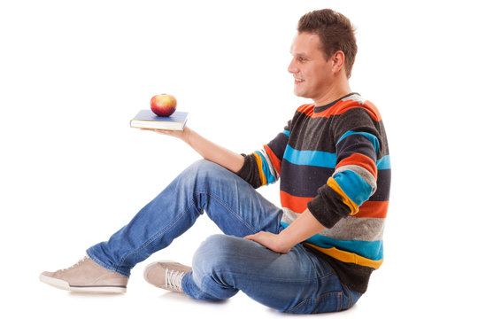 Man Holding Book And Red Apple. Healthy Mind And Body