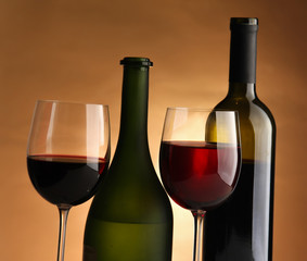 A glass of wine and a bottle