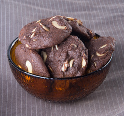 Almonds chocolate chips cookies on background