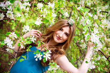Beautiful young woman with flowers.