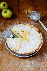 round apple pie with butter