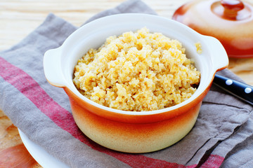 yellow wheat porridge in a pot