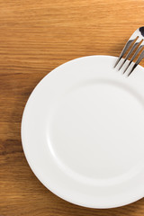 fork and plate at cutting board