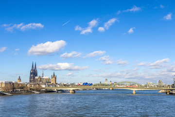 Fototapeta premium Cologne skyline with dome and bridge