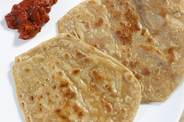 A paratha (or parantha) is a flatbread that originated in India
