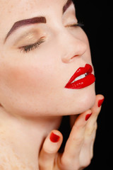 Naklejka premium Portrait of young pretty model with bright makeup and manicure.