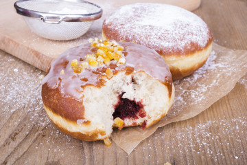 bitten donut on a wooden table