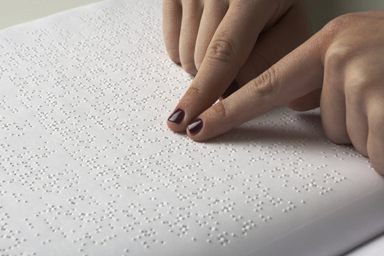 Blind reading text in braille language