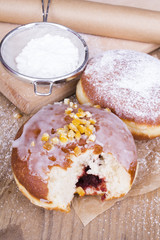 bitten donut on a wooden table