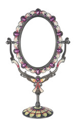Metallic mirror on a stand on a white background, souvenir